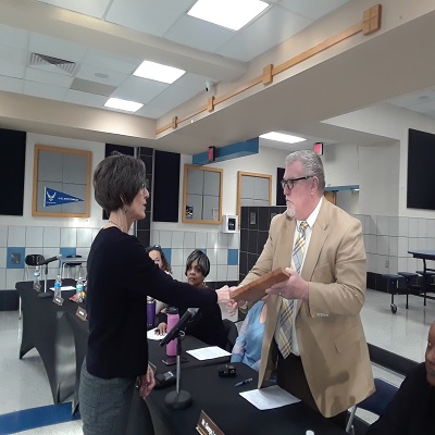  Mary Beth Lopez accepts plaque form George Lammay